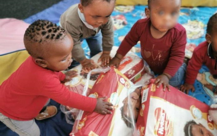 toddlers receiving nappies