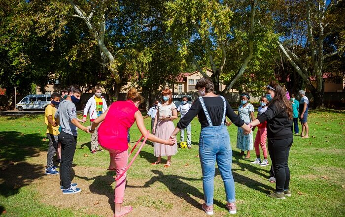 kids playing in a circle outside