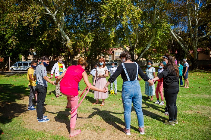 kids playing in a circle outside